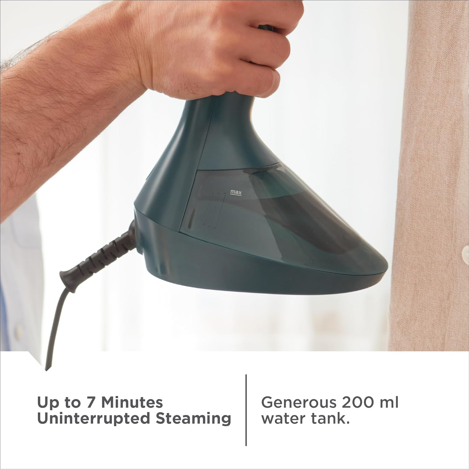 Hand holding a green handheld steamer with text about steam time and water tank capacity.