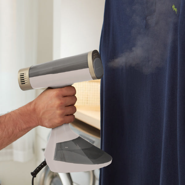 Closeup of person steaming shirt