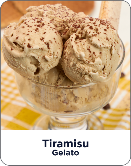 Three scoops of tiramisu gelato in a glass bowl on a yellow checkered tablecloth.