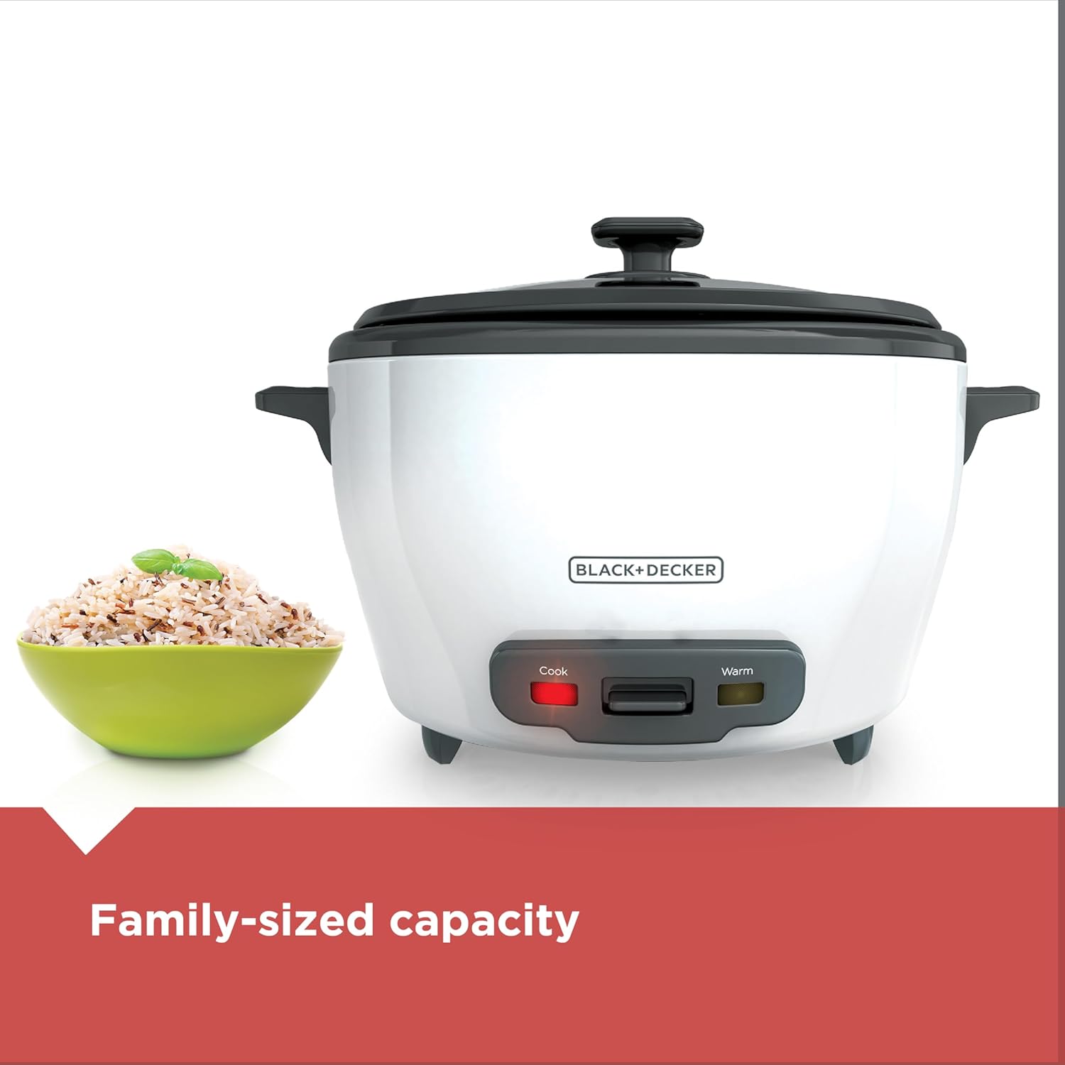 White rice cooker with black lid next to a bowl of rice on a white background