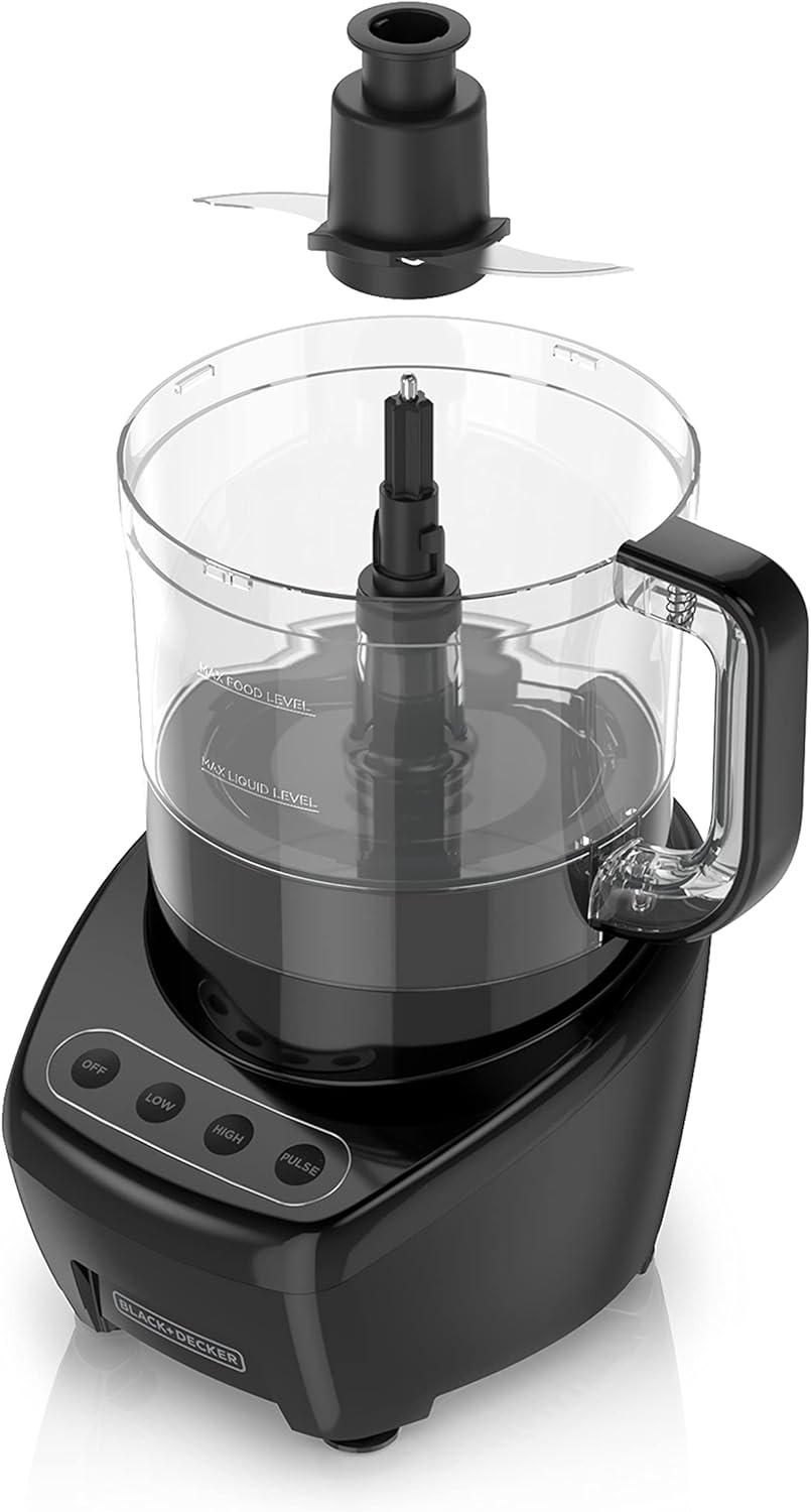 Black food processor with clear container on a white background