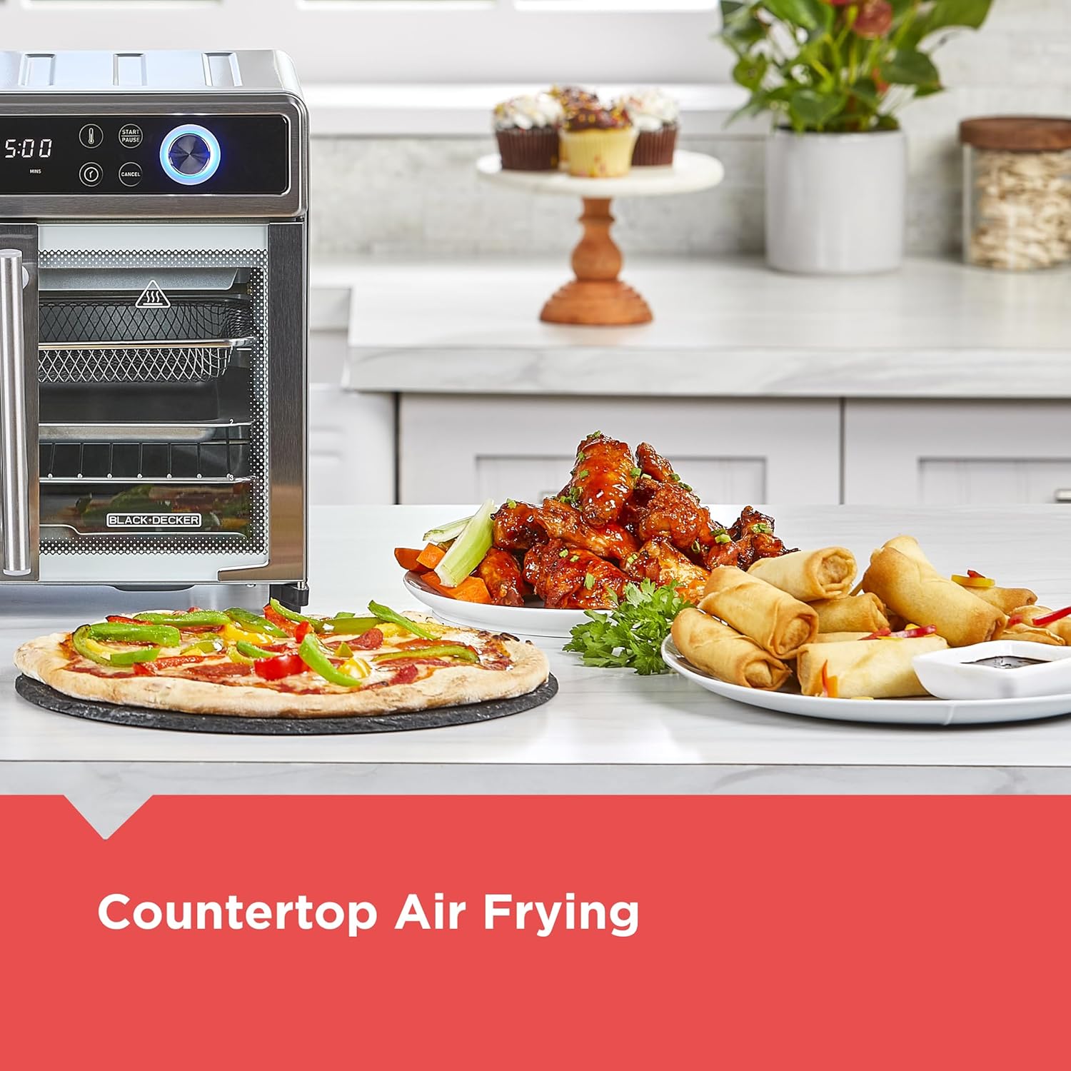Countertop air fryer with cooked food on a kitchen counter