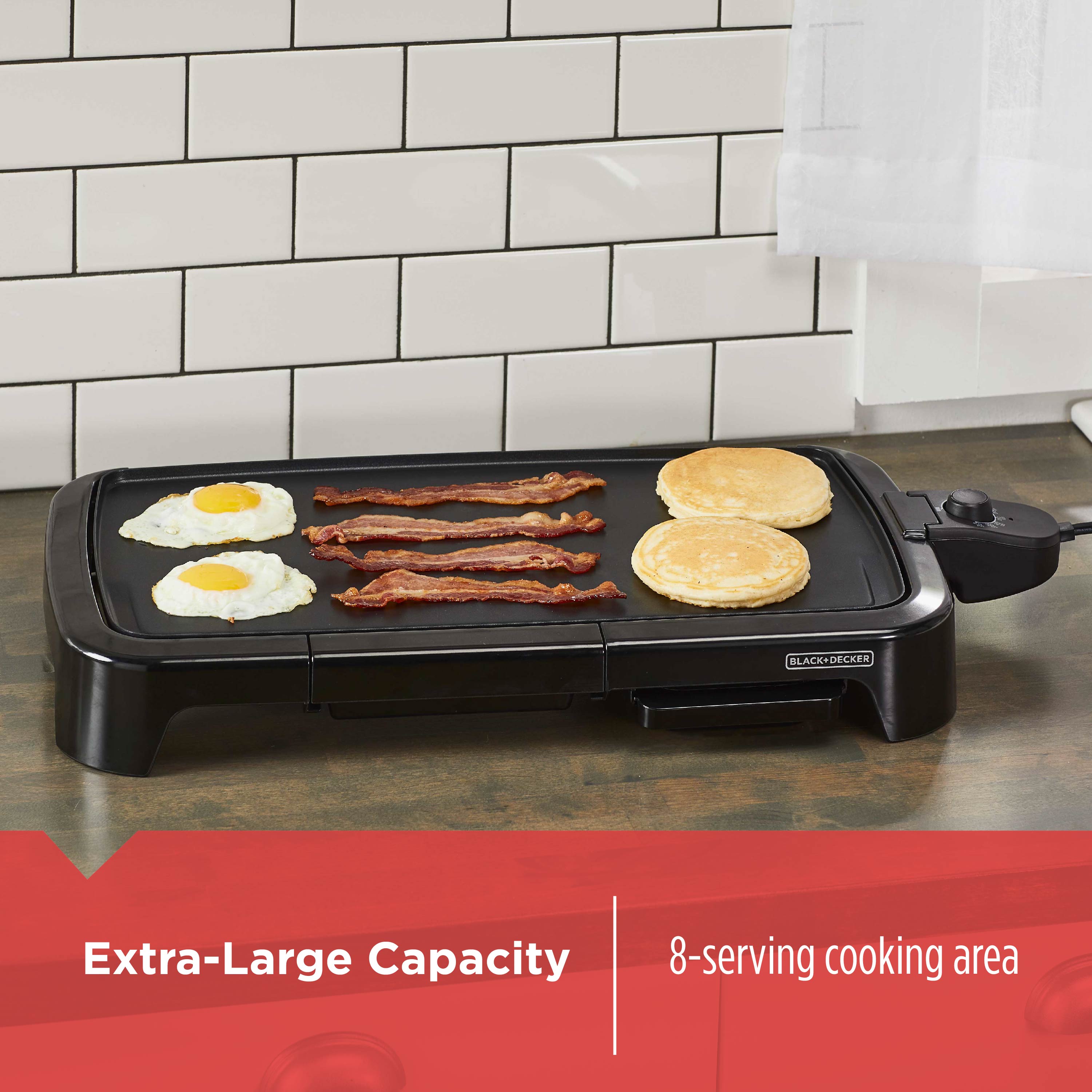 Black electric griddle with food on a kitchen counter, featuring 'Extra-Large Capacity' text.