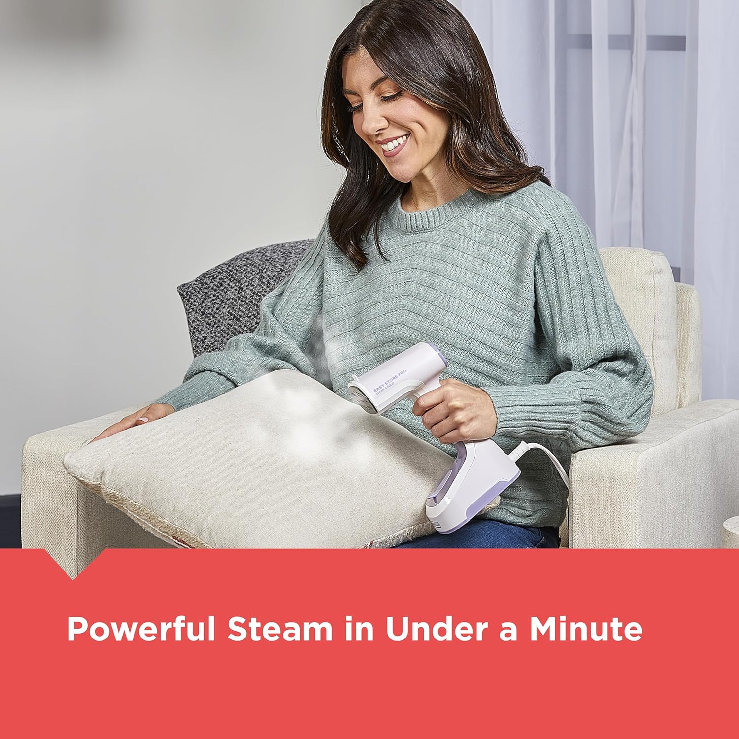 Woman using a steam cleaner on a pillow with a neutral background