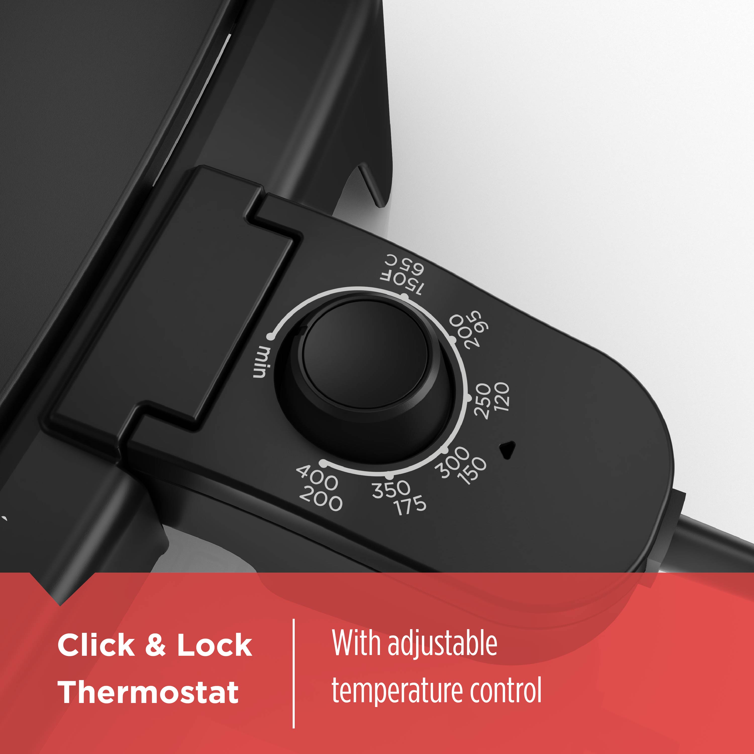 Black oven with adjustable temperature control knob on a white background