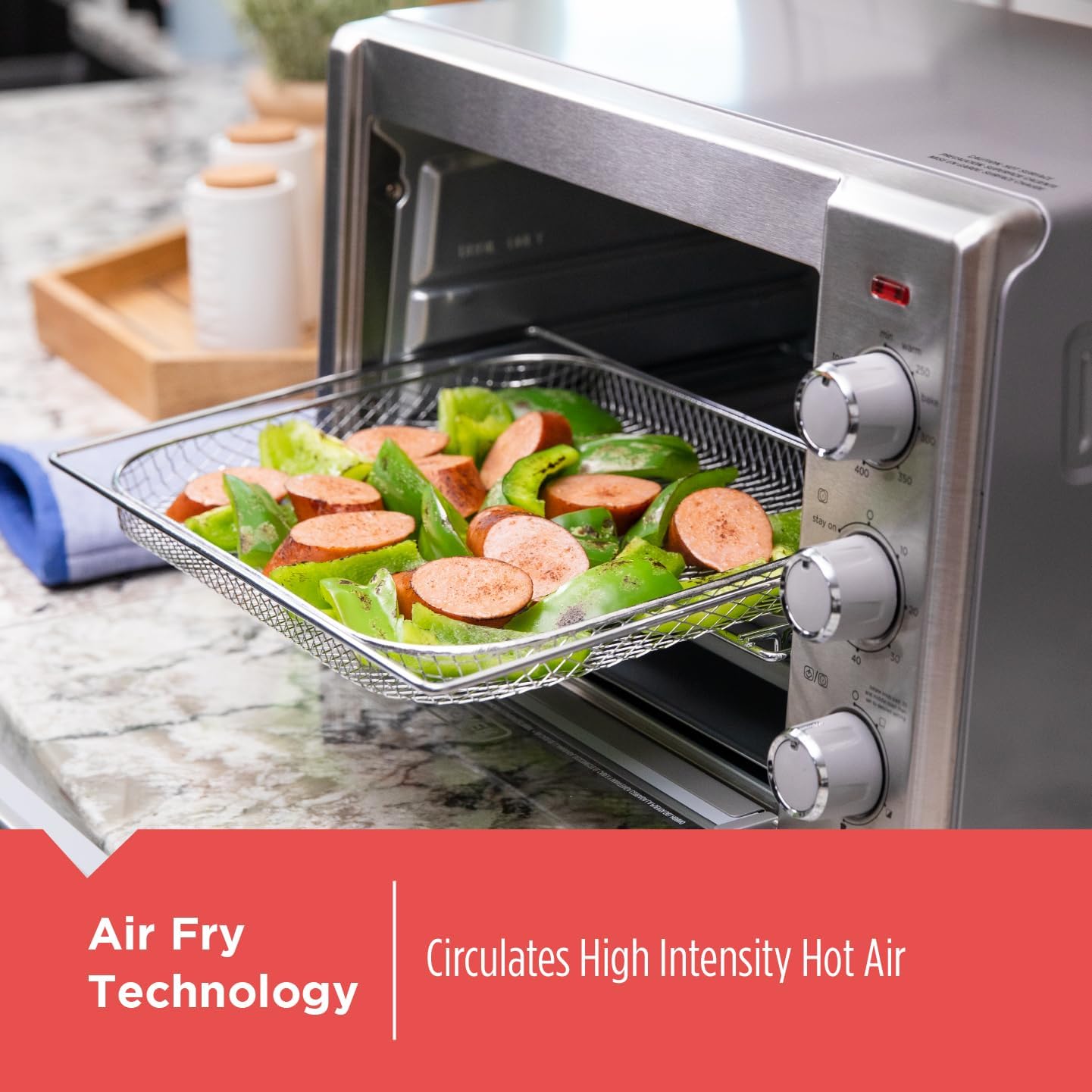 Air fryer with food inside on a kitchen counter, featuring text about air fry technology.