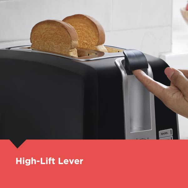 Black toaster with two slices of bread and a hand using the high-lift lever.