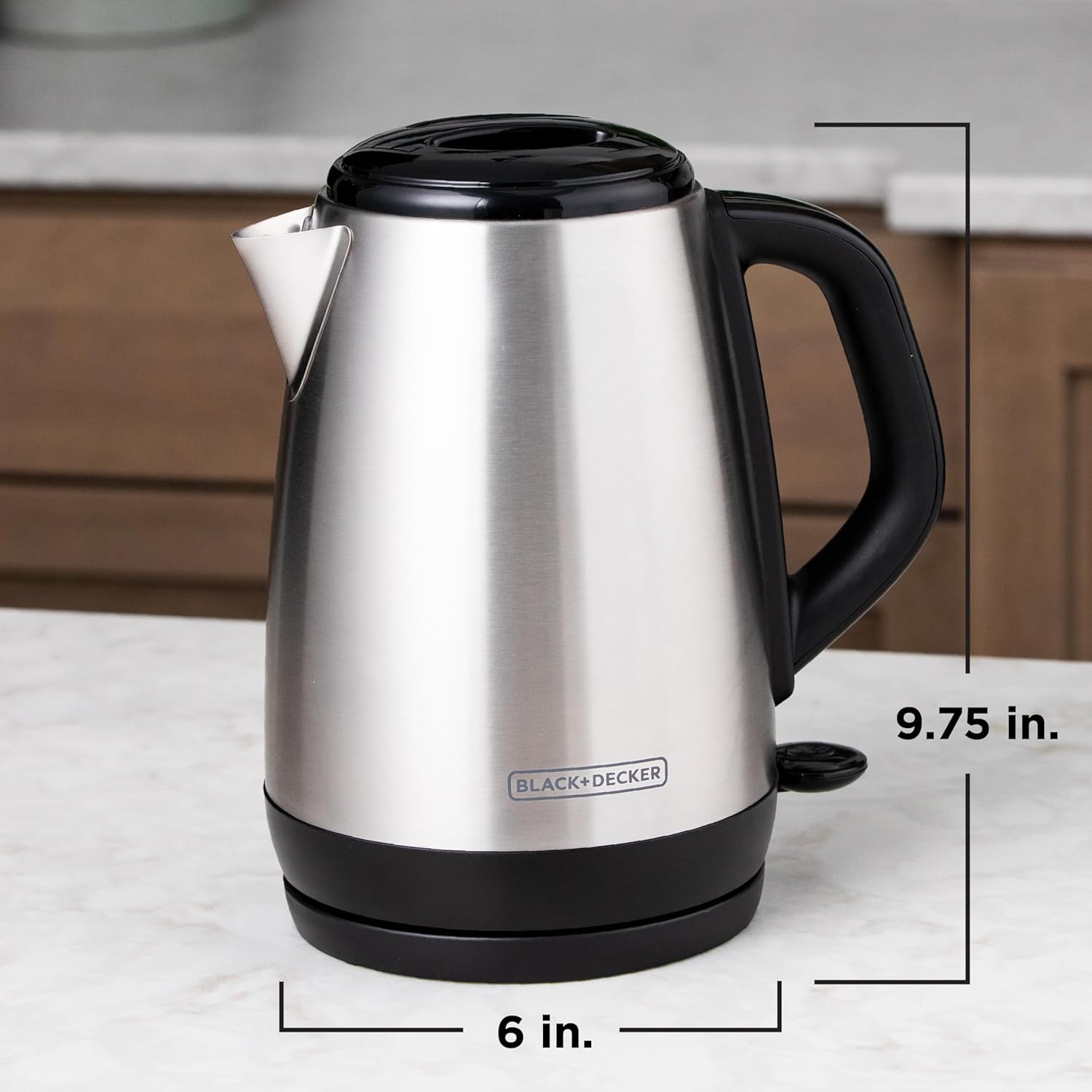 Black+Decker electric kettle on a kitchen counter with dimensions displayed