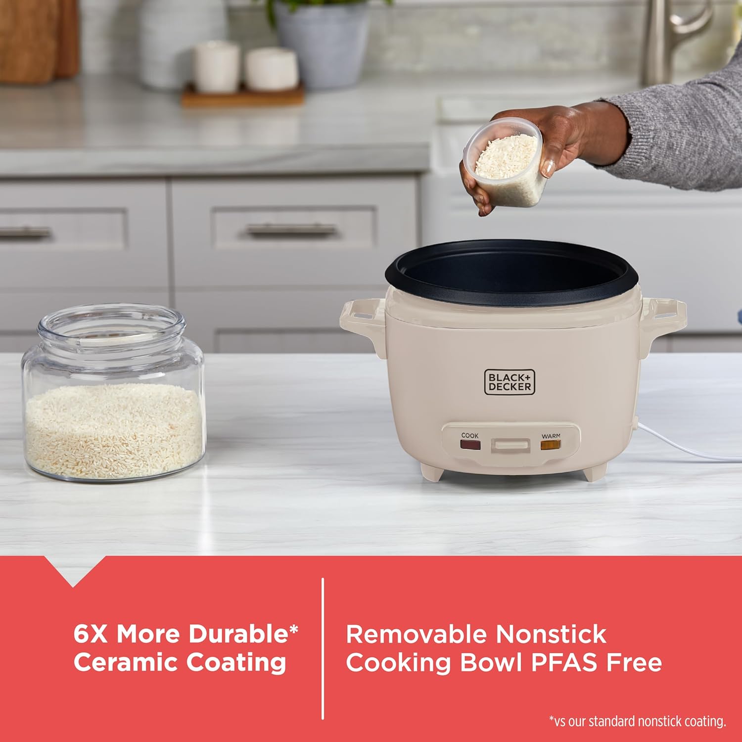 Person pouring rice into a beige rice cooker with text highlighting features on a kitchen counter.