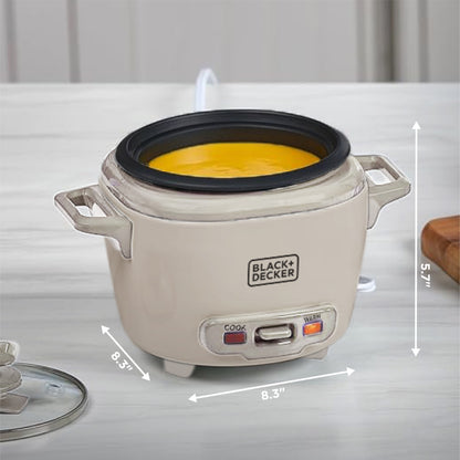 Black+Decker rice cooker with measurements on a white surface