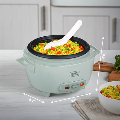 Green rice cooker with food inside on a kitchen counter, showing dimensions.
