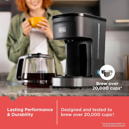 Black and Decker coffee maker on a kitchen counter with a woman holding a cup in the background.