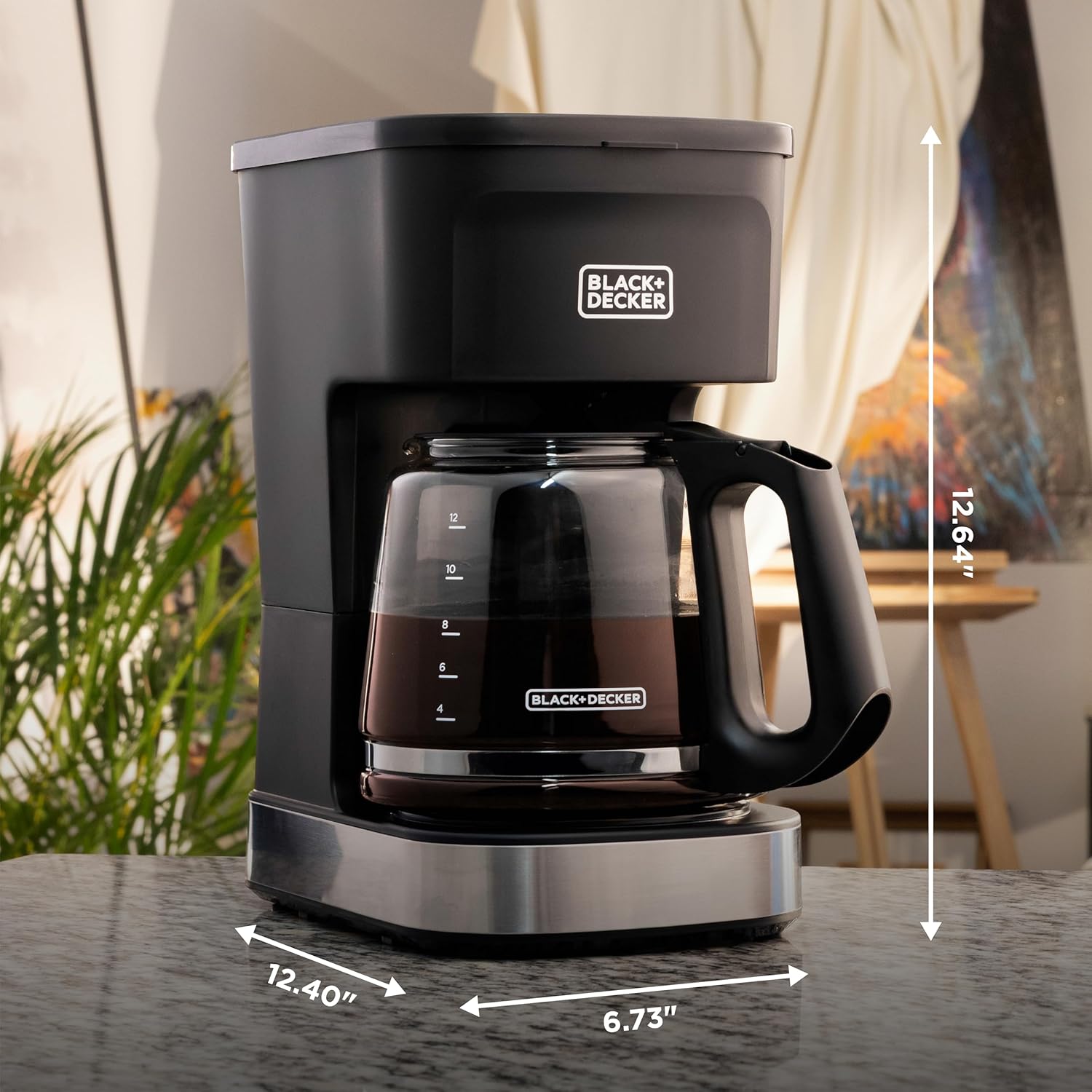Black and Decker coffee maker with dimensions displayed on a table.