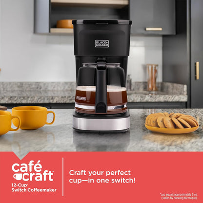 Black & Decker coffee maker on a kitchen counter with yellow mugs and cookies.