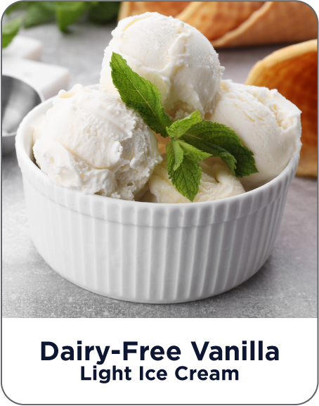 Bowl of dairy-free vanilla light ice cream with mint leaves on a gray surface
