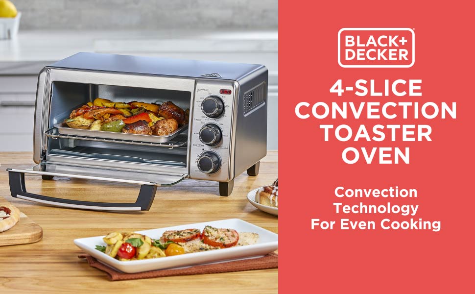 Black+Decker 4-slice convection toaster oven with food inside on a wooden countertop.