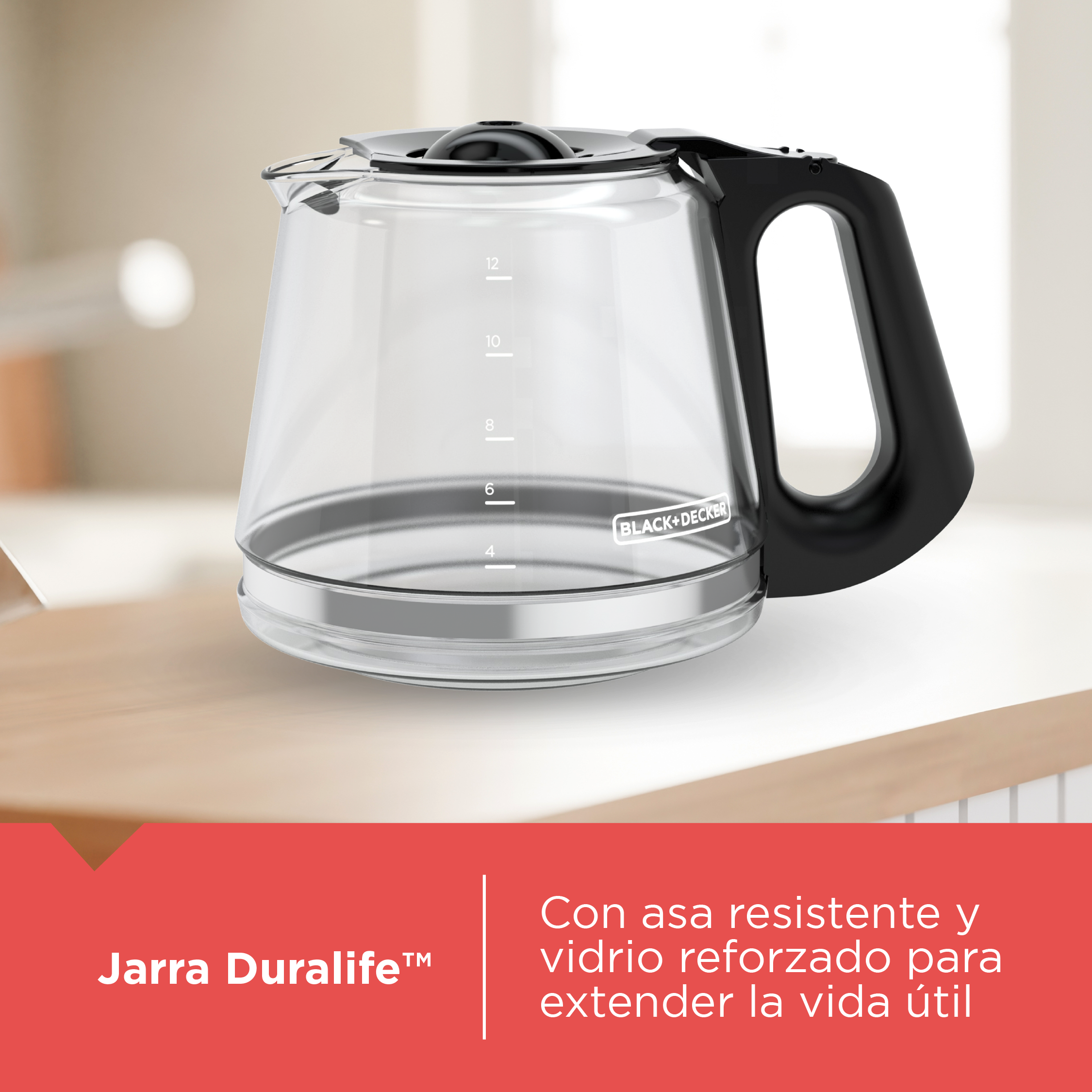 Clear glass jar with black handle on a light surface, featuring Black & Decker branding.