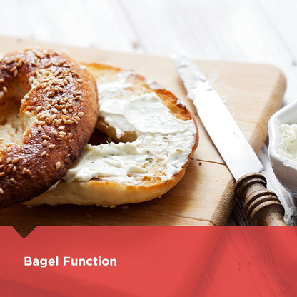 Bagel with cream cheese on a wooden cutting board with a knife and bowl of cream cheese.
