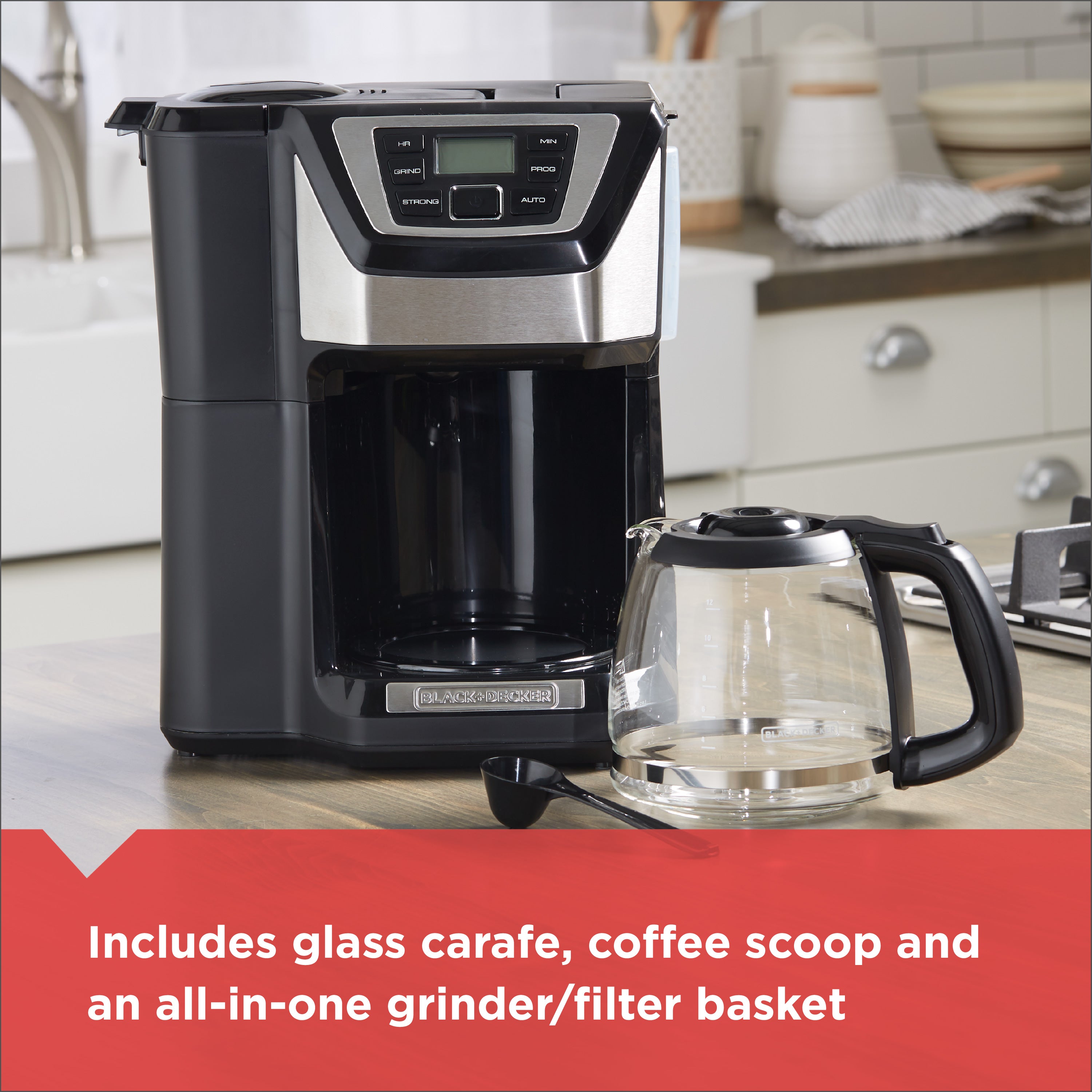 Black coffee maker with glass carafe on a kitchen counter