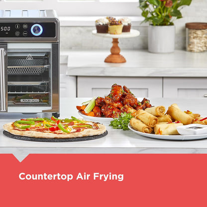 Countertop air fryer with cooked food on a kitchen counter