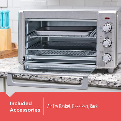 Silver toaster oven with included accessories on a kitchen counter