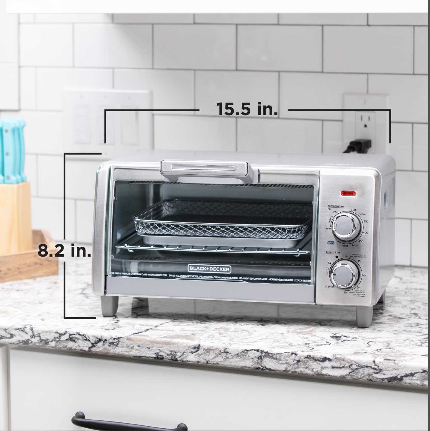 Toaster oven on a kitchen counter with dimensions labeled