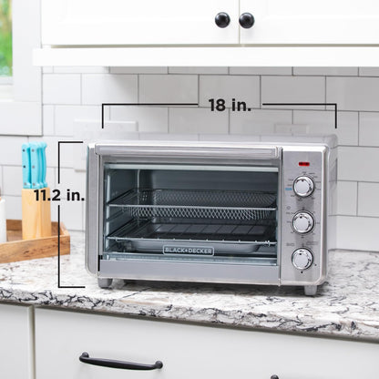 Black & Decker toaster oven on a kitchen counter with dimensions labeled