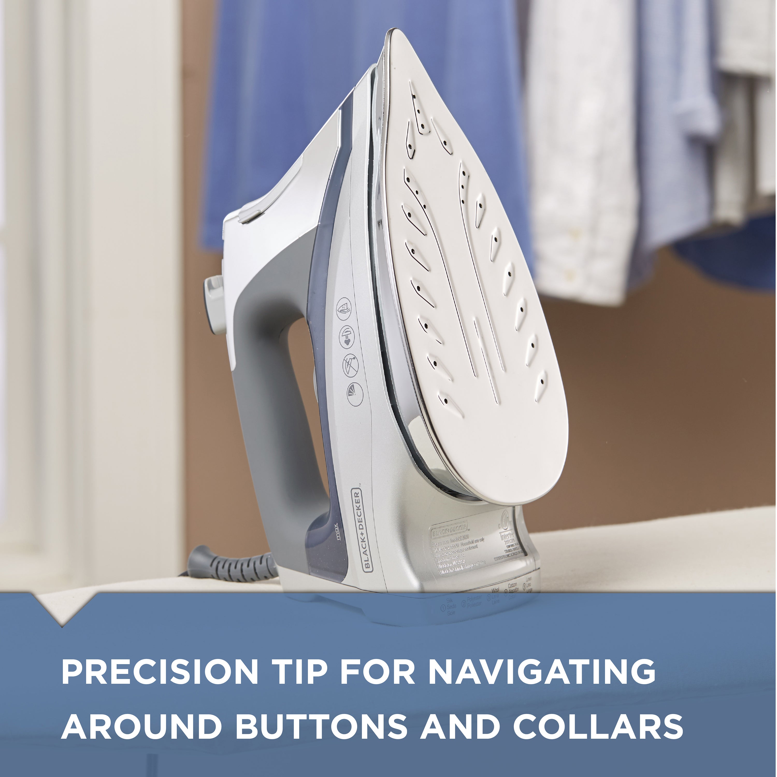 White iron with gray handle on a white surface, with text about precision tip for navigating around buttons and collars.