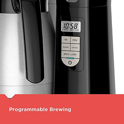 Coffee maker with digital display and control panel on a white background